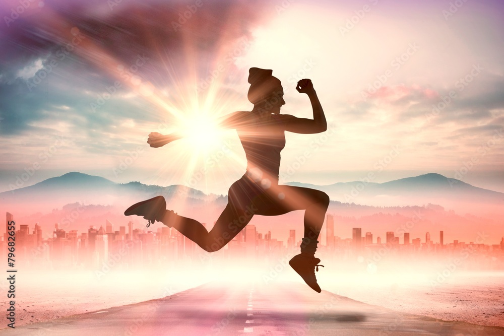 Poster Composite image of fit brunette running and jumping