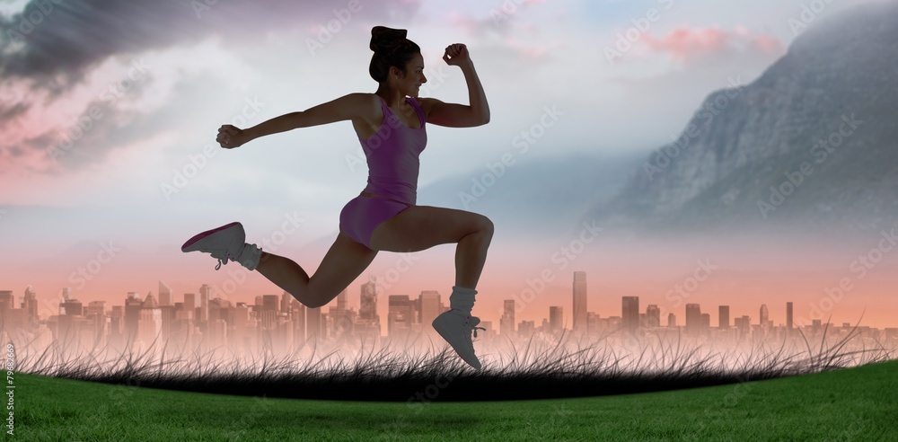 Poster Composite image of fit brunette running and jumping