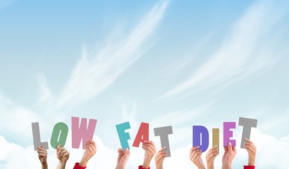 Composite image of hands holding up low fat diet