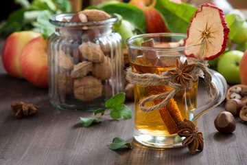 apple cider with spices in a glass cup
