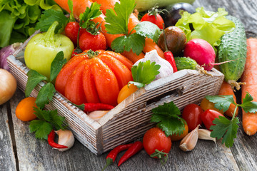 harvest of fresh seasonal vegetables in a wooden box