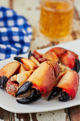 Boiled crab claws on a plate and beer © irrez