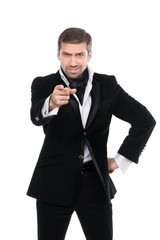 Young stylish businessman pointing finger at viewer. Isolated on