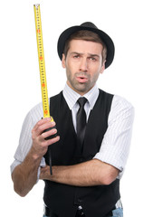 Handsome man in black hat with measure tape. Isolated over white