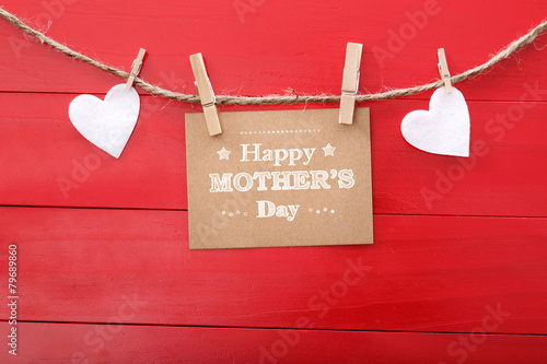 Mothers day message with felt hearts hanging with clothespins