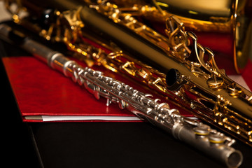 Flute and saxophone closeup in dark colors