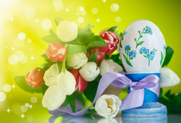 Decorative easter egg with a bouquet of spring tulips