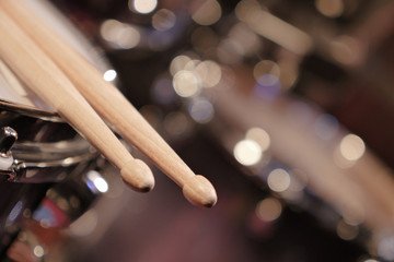 Drum sticks lay on an drum set