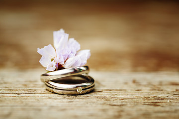 Wedding rings close up in rustic style