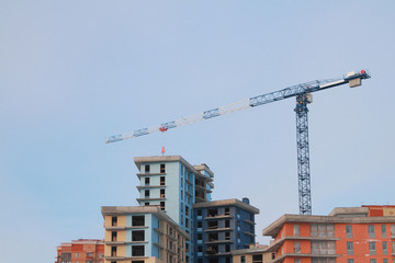 Tower crane and house under construction. Kazan, Tatarstan