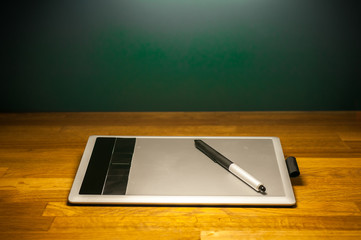 drawing tablet on wood desk table