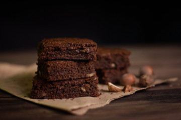 Brownie chocolate cake on the table, dark background