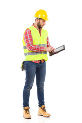 Focused worker using a digital tablet