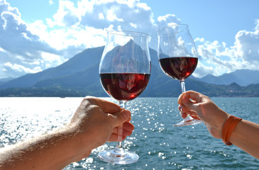 Two wineglasses in the hands