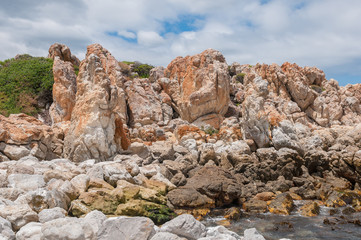 Multi-colored rocks at the harbor in Kleinmond