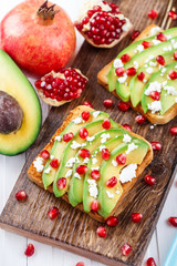 Avocado sandwich with feta and pomegranate