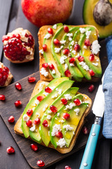 Avocado sandwich with feta and pomegranate