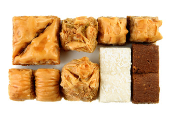 Variety of Turkish baklava on a white background