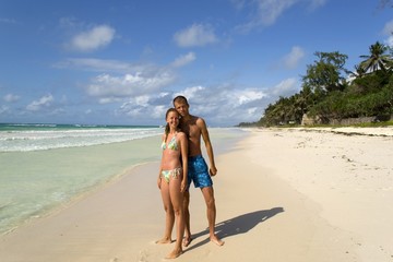 Happy couple on white tropical beach