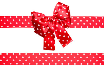 red bow and ribbon with white polka dots made from silk
