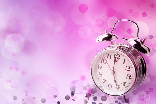 Clock on pink background