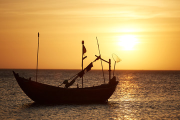 Fishing boats at sunset