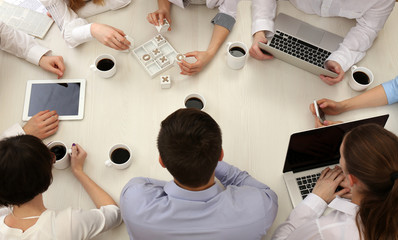 Group of business people working at desk top view