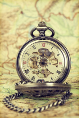 Vintage watch on antique map