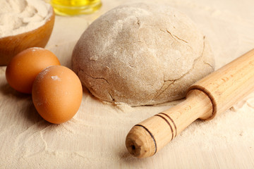 Making bread on wooden table background