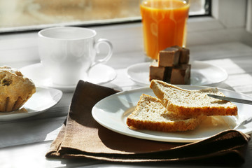 Delicious breakfast on windowsill background