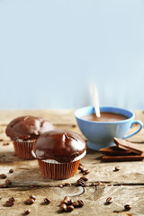 Tasty homemade chocolate muffins and cup of coffee