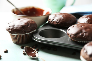 Tasty homemade chocolate muffins and cup of coffee