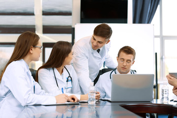 Medical workers working in conference room