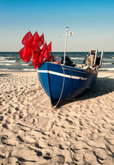 Traditionalfisherman boat on a sandy shore