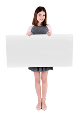 Beautiful young woman holding blank poster isolated on white