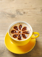 Cup of coffee on old wooden table