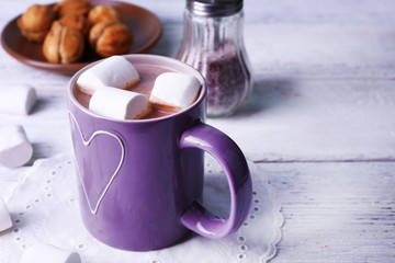 Cup of cocoa with marshmallows and cookies