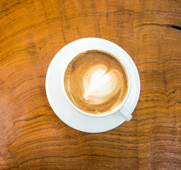 heart pattern latte coffee on the wooden table