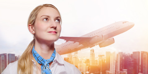 Young Stewardess in front of urban background