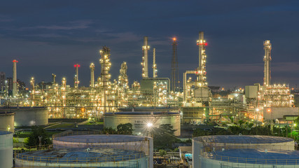 Fototapeta na wymiar Panorama of Oil refinery and storage tanks at twilight