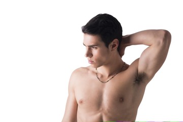 Attractive fit young man with hand behind head, isolated on