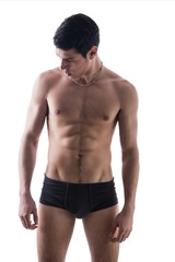 Fototapeta premium Handsome, fit young man in underwear isolated on white