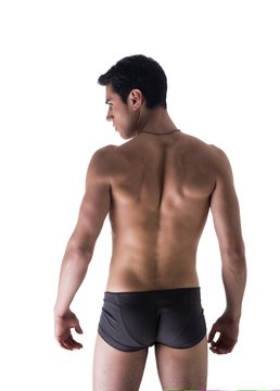 Back of handsome young man in underwear isolated on white