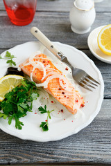 Tasty salmon on a white plate