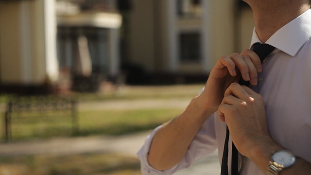 the guy on the street wear a tie