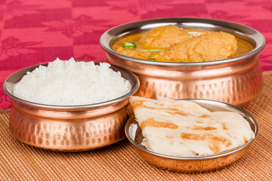 Indian Chicken Curry Meal with Rice and Parotta