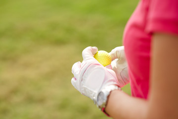 Hands with golf ball