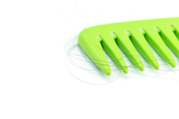 Green comb with hair