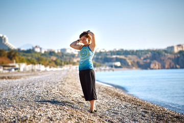 girl plays on the sea beach
