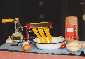 Fresh pasta cutting in machine.